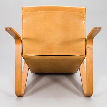 EERO SAARINEN, a 'Grasshopper' armchar and ottoman manufactured under licens by Tetrimäki Finland.