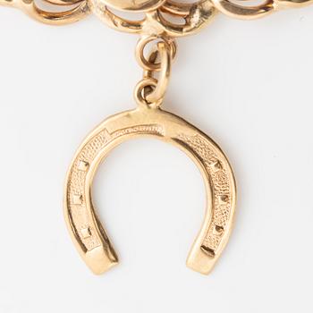 Armband 18K guld bismarcklänk, med berlocker.