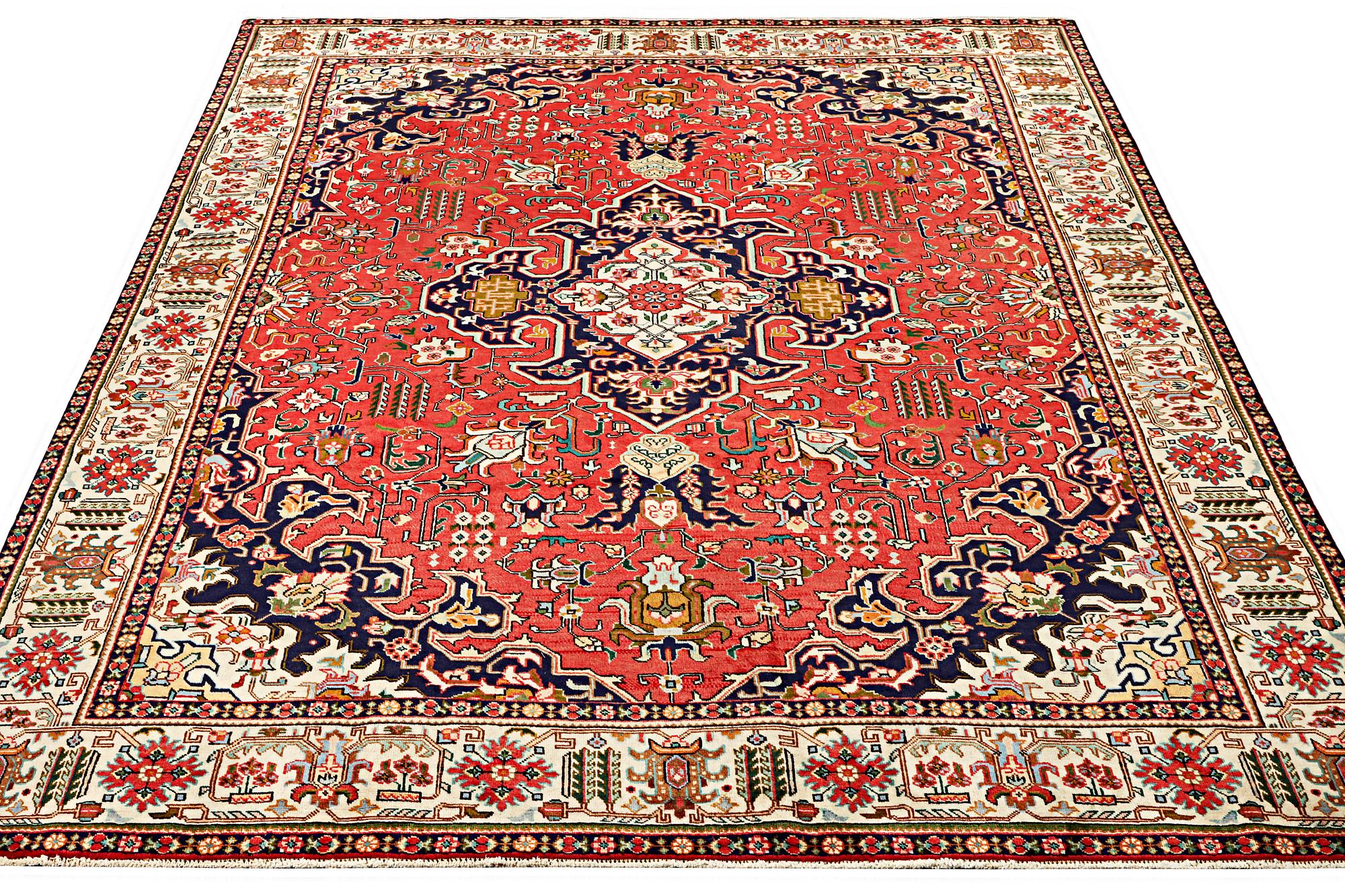 A Tabriz carpet, c. 335 x 257 cm.