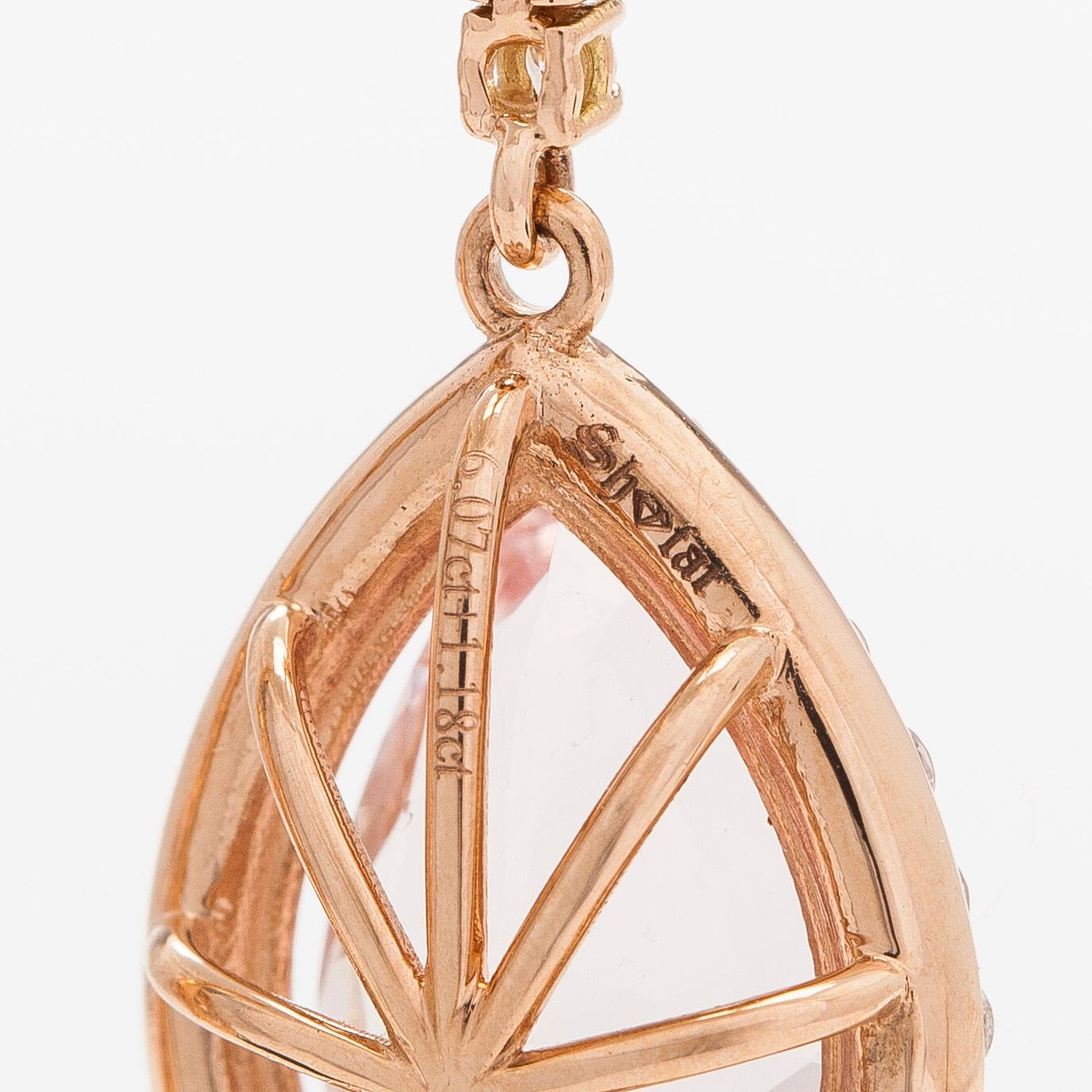 A pair of 18K gold earrings, with pear-cut morganites and diamonds.