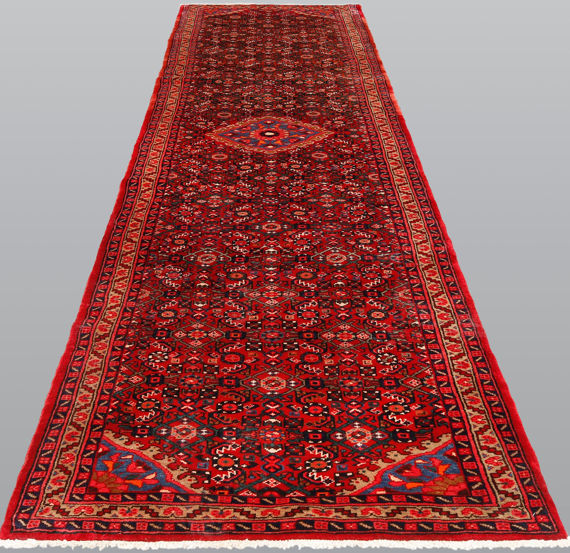 A Hosseinabad runner, ca 427 x 110 cm.