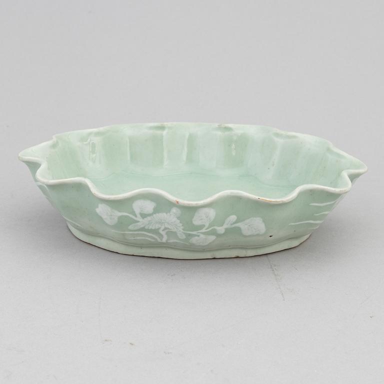 A Chinese celadon glazed lotus leaf shaped bowl, late Qing dynasty, and a ge-glazed brush washer, possibly 20 century.