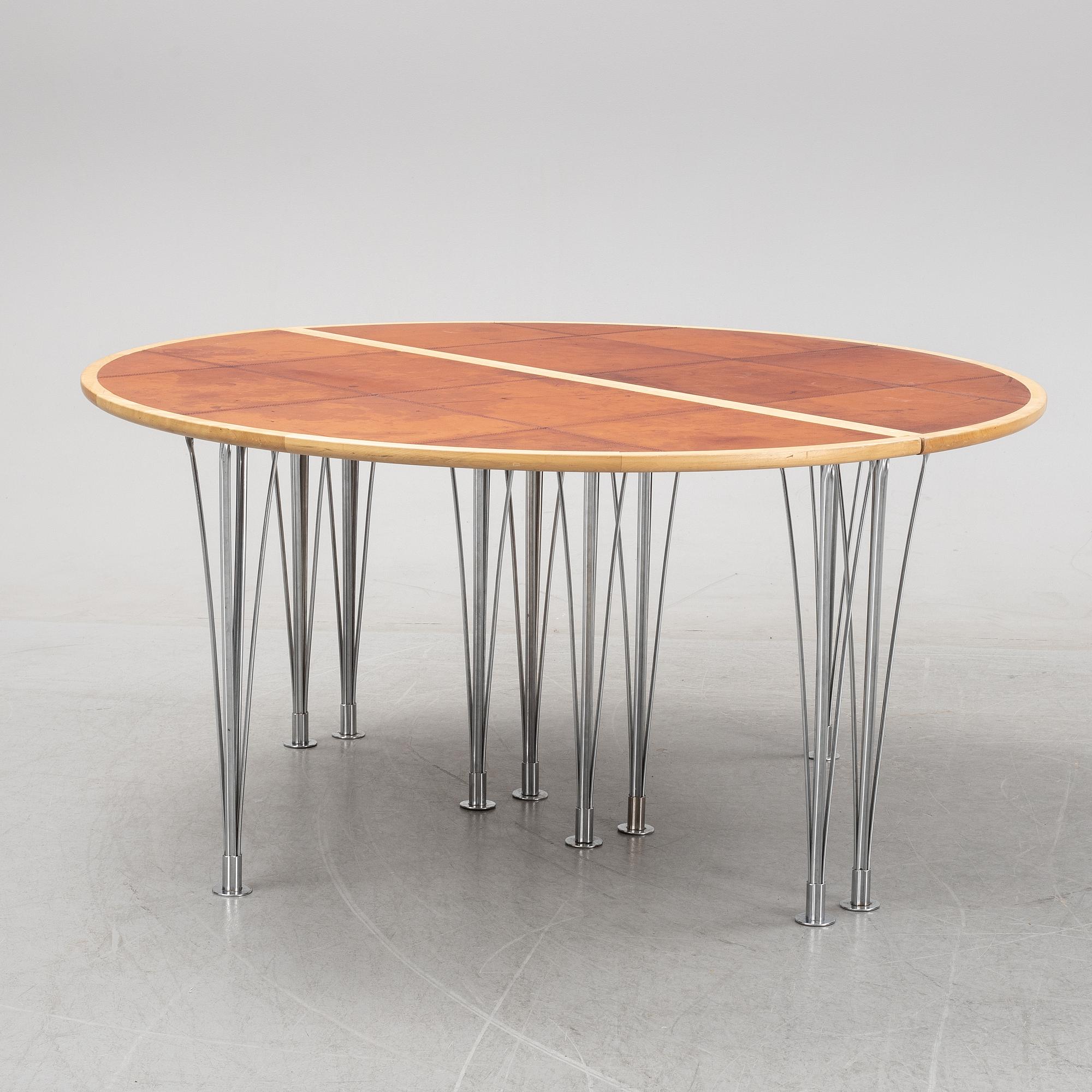 A birch and leather dining table in two parts, Mathsson International, 21th century.