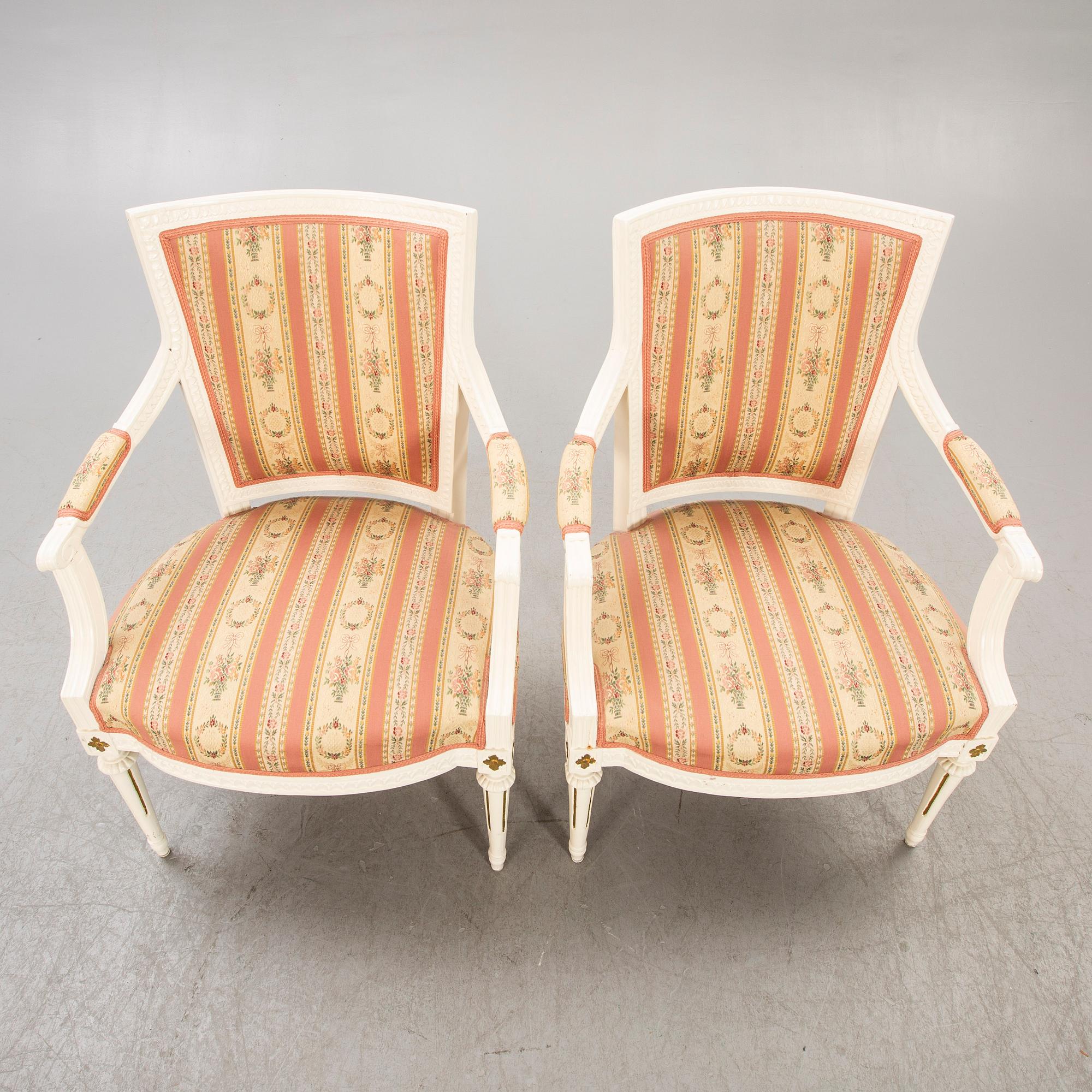 A pair of Swedish painted late Gustavian armchairs around 1800.