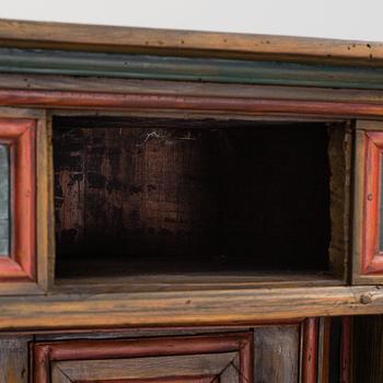 A 18th century corner cabinet.