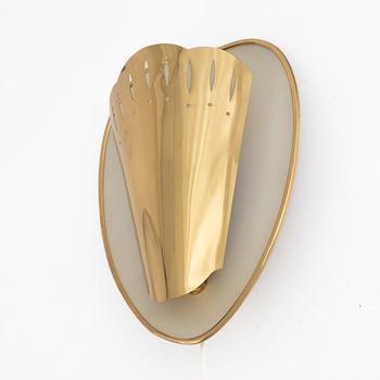 A Swedish Modern brass wall sconce, 1950's.