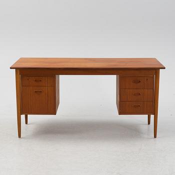 A teak veneered desk, 1950's/1960's.