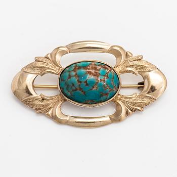 Elis Kauppi, A gilded silver brooch with a glass stone. Kupittaan kulta, Turku, 1940's.