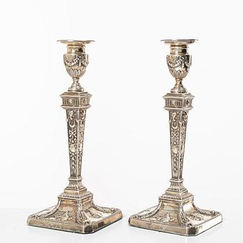 A pair of English silver candlesticks, mark of William Hutton & Sons Ltd, London 1902.