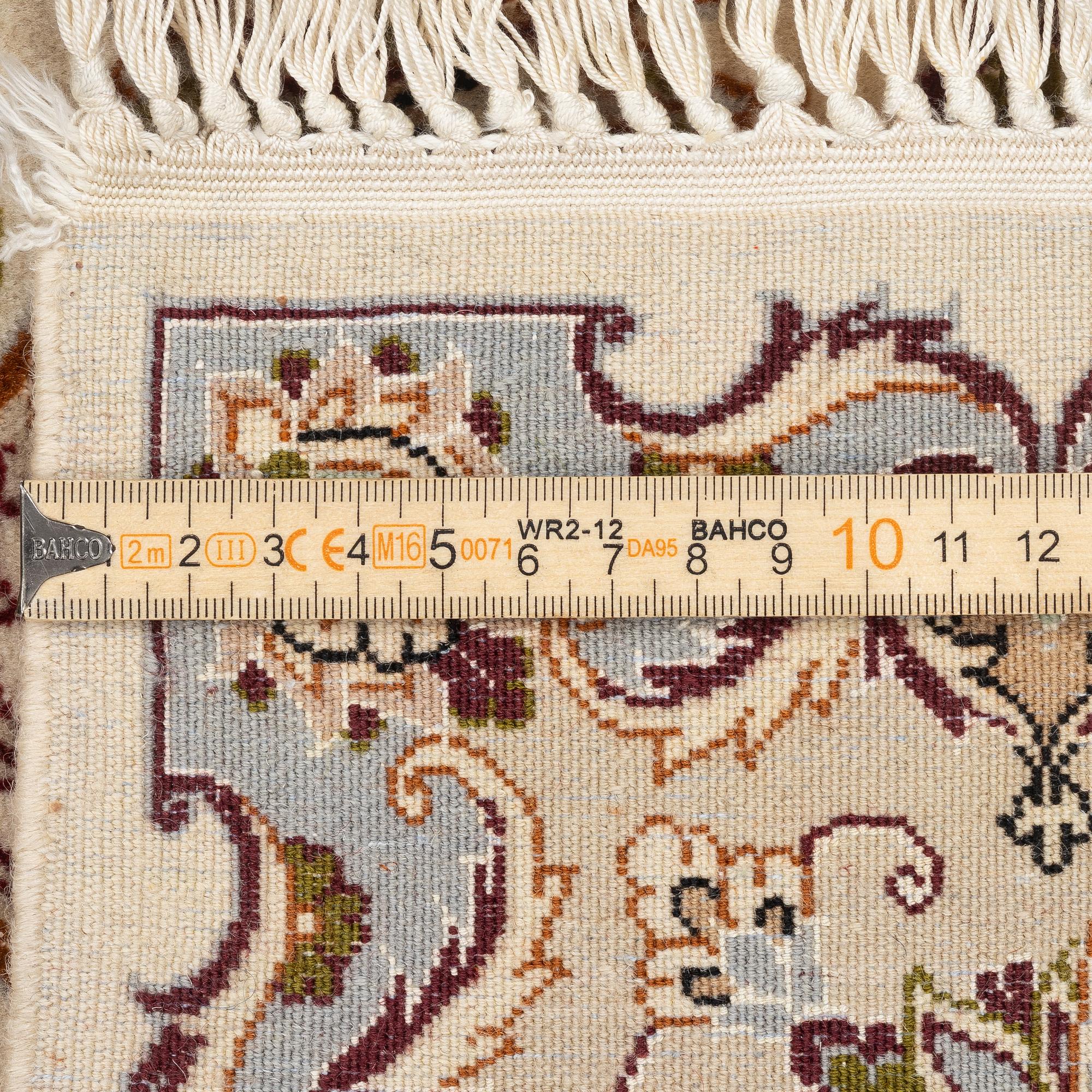 An Isfahan part silk rug, c. 161 x 110 cm.