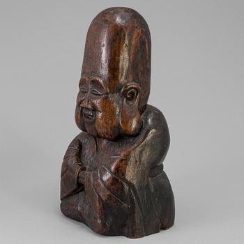 A wooden scultpure of a lohan, China, 20th Century.