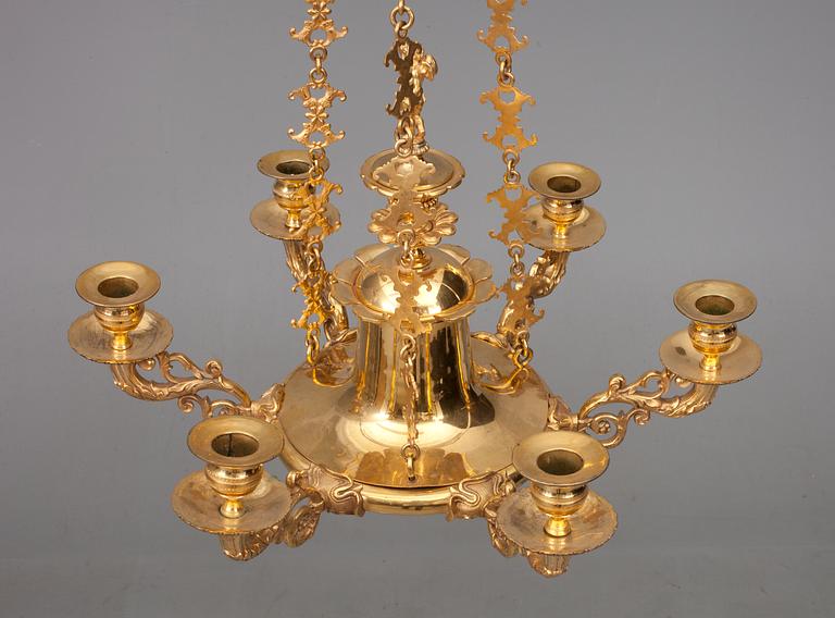 A CHANDELIER, For sex candles. Fire gilded. Empire style, early 19th century.