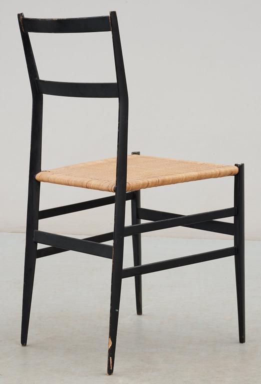 A Gio Ponti 'Superleggera' chair, Cassina, Italy, black painted ash with ratten seat.
