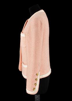 A pink/white bouclé jacket by Chanel.