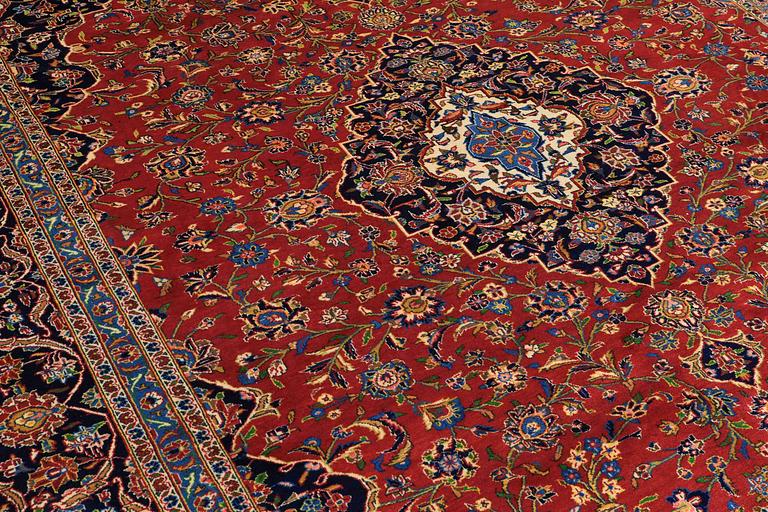 A carpet, Kashan, signed, ca 353 x 287 cm.