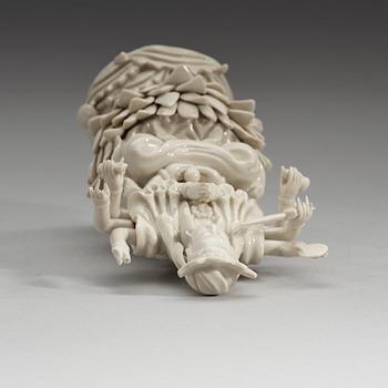 An eigth armed blanc de chine figure of a Bodhisattva, Qing dynasty, 19th Century.