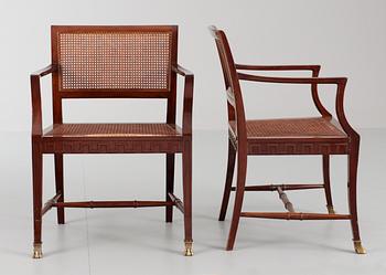 A pair of mahogany and ratten armchairs, Nordiska Kompaniet, Stockholm 1920's-30's.