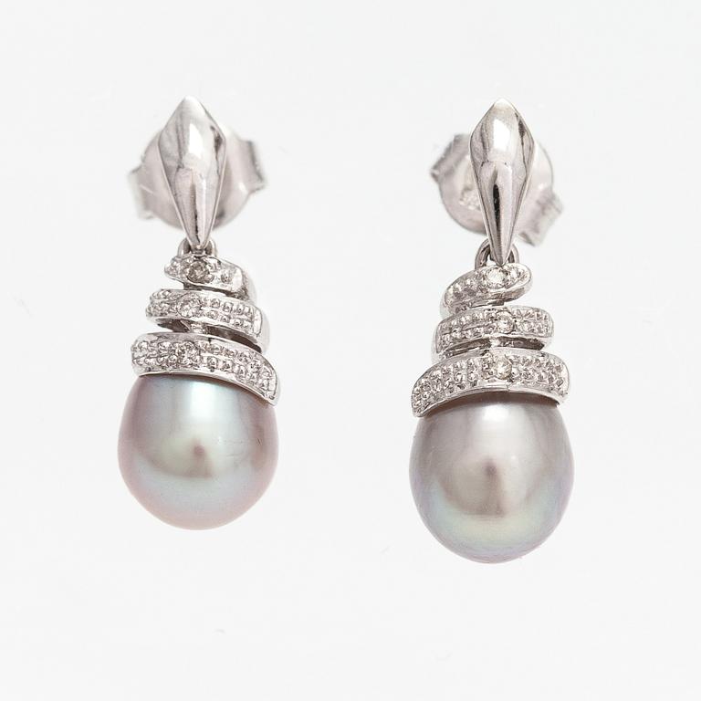 A pair of 14K white gold earrings with cultured pearls and diamonds ca. 0.06 ct in total. Caratia, Helsinki 2001.