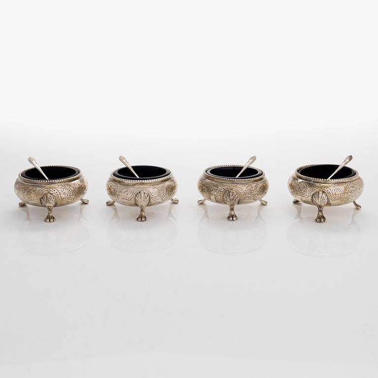 Four sterling silver salt cellars, London 1864, and four salt spoons, Birmingham 1987.