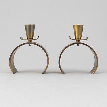 Carl-Einar Borgström, a pair of 'Svalan' candlesticks, Ystad metal, first half of the 20th Century.