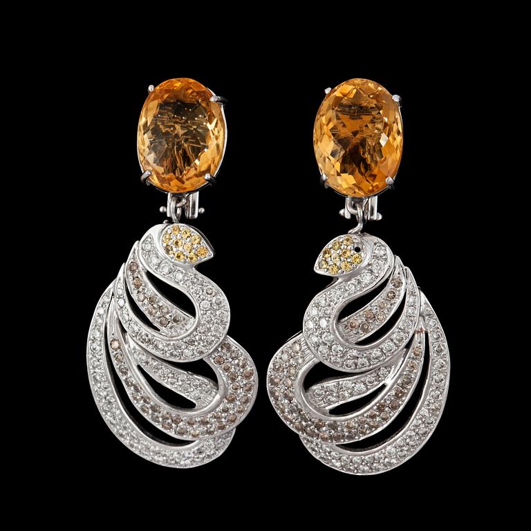 A pair of citrine and brown, yellow and white diamonds.