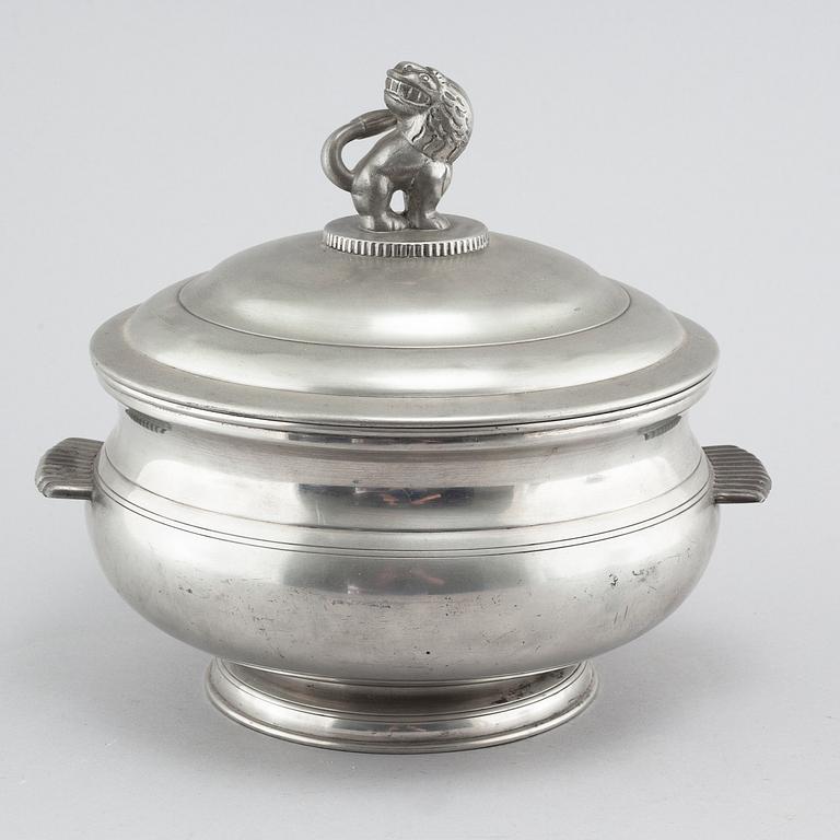 A lidded pewter terrine, model 277, Firma Svenskt tenn 1926. The lion probably designed by Anna Petrus.