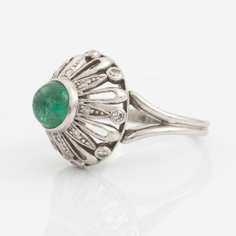 An A Tillander ring set with a cabochon-cut emerald.