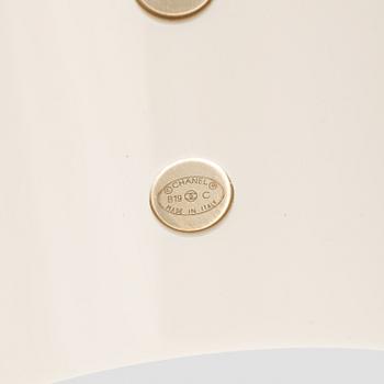 Chanel, a white acrylic bracelet with pearls, 2019.