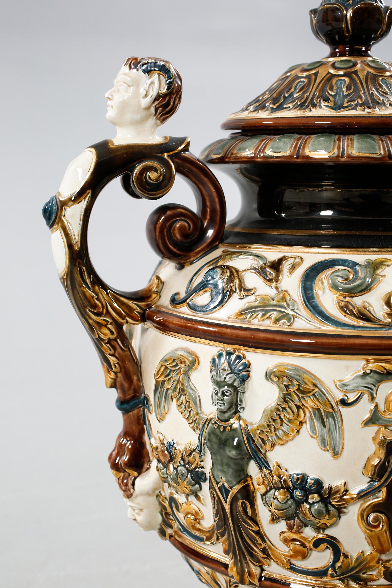 A majolica urn with pedestal from Rörstrand, around the year 1900.