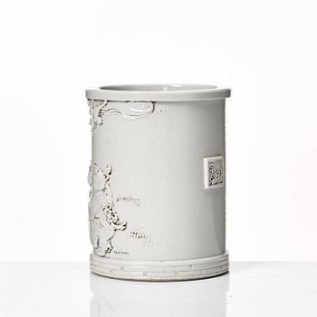 A white glazed Chinese brush pot, presumably late Qing dynasty.