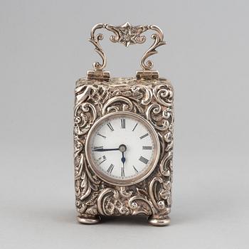 A rococo-style silver clock, mark of Henry Matthews, Chester 1903.
