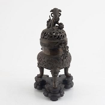 A tripod bronze censer with cover, Qing dynasty, 19th century.