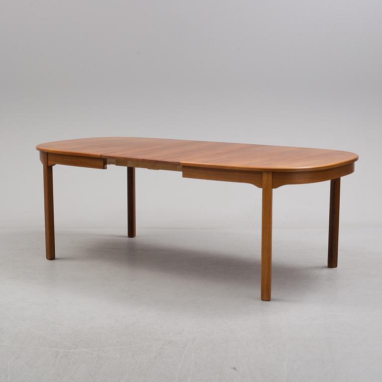 A Carl Malmsten "Ambassadör" dining table and four chairs  , second half of the 20th century. One extension leaf.