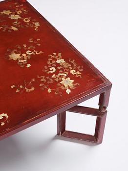 A Chinese red low table, 20th century.