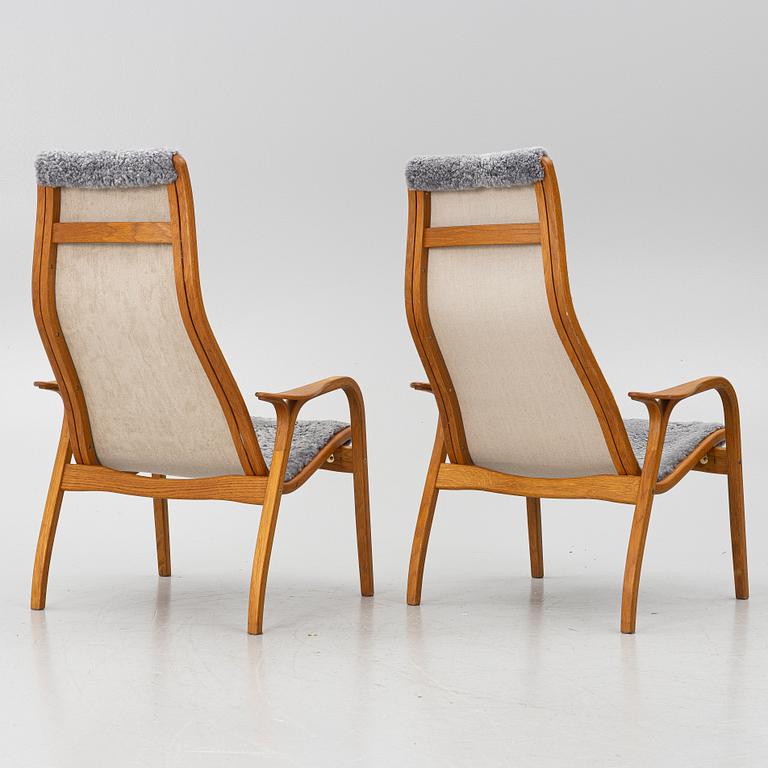 Yngve Ekström, A pair of armchairs, a footstool, “Lamino”, and a side table, Swedese, 2000s.