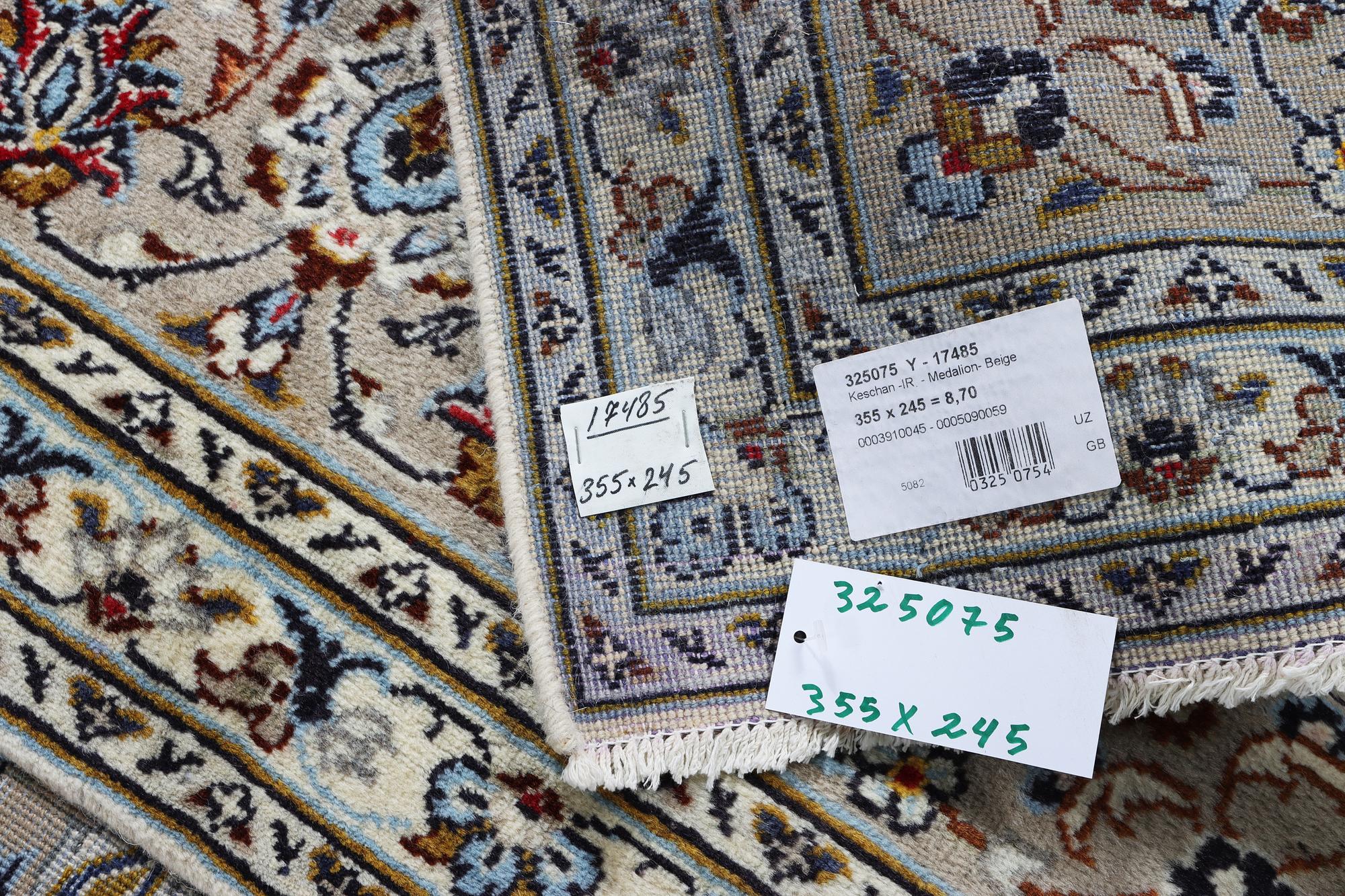 A Kashan carpet, c. 355 x 245 cm.