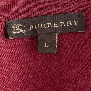 BURBERRY, a burgundy red merino wool cardigan.