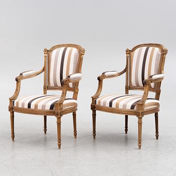 A pair of Louis XVI-style armchairs, late 19th century.