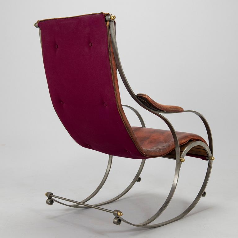 A 20th century steel frame rocking chair.