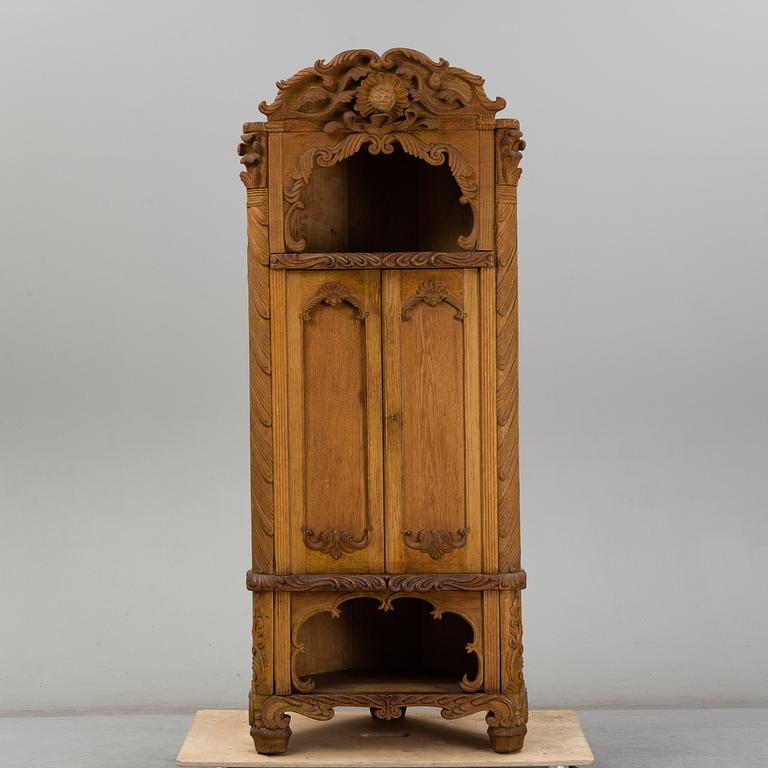 KNUT FJAESTAD, a folk art oak cabinet, signed KF 1935.