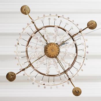 A late Gustavian four-light chandelier, early 19th century.