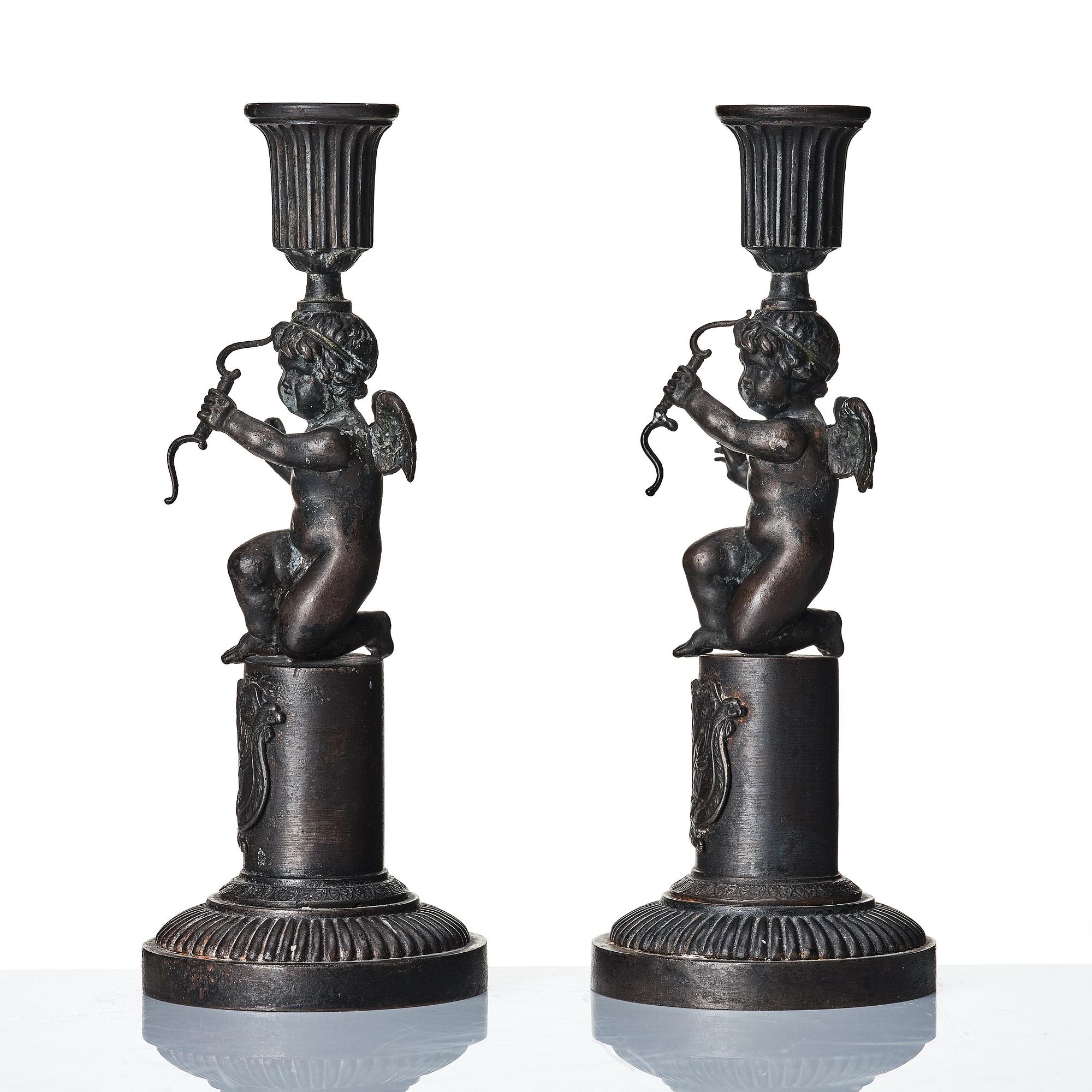 A pair of German (Berliner Eisen) Empire iron candle sticks.