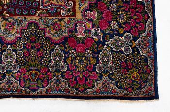 A semi-antique Kirman carpet, south Persia, c. 440 x 279 cm.