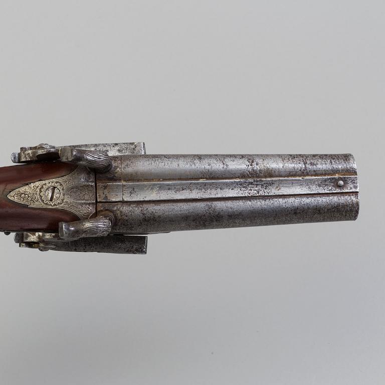 A 19th century double barreled percussion pistol.