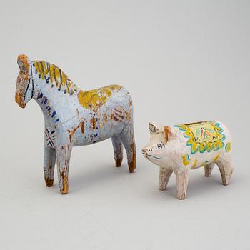 A painted folk art dala horse and dala pig, first half of the 20th century.