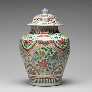 639. A Transitional wucai baluster vase with cover, 17th Century.