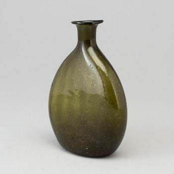 A 18th century glass bottle.