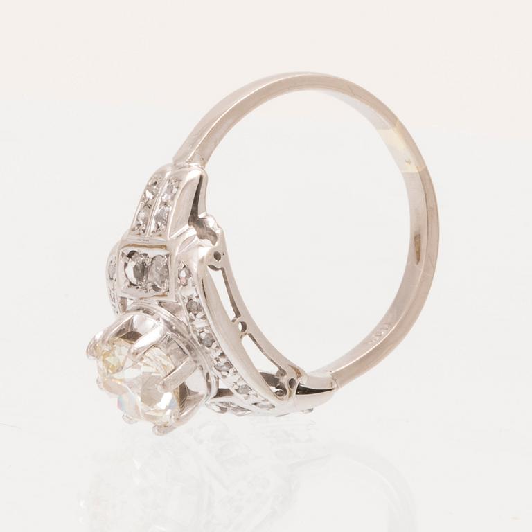 An 18K white gold ring set with an old cut diamond and rose cut diamonds.