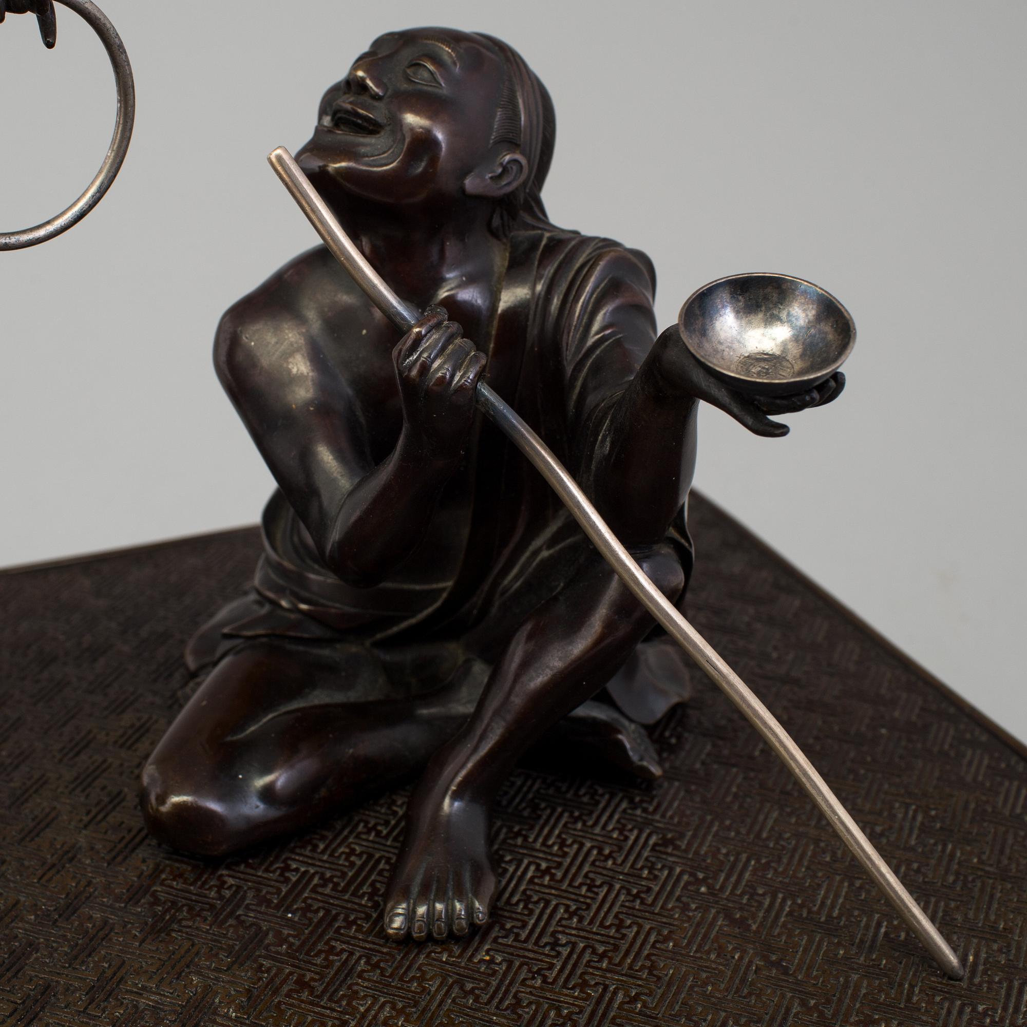 A Japanese bronze sculpture group, Meiji period (1868-1912).