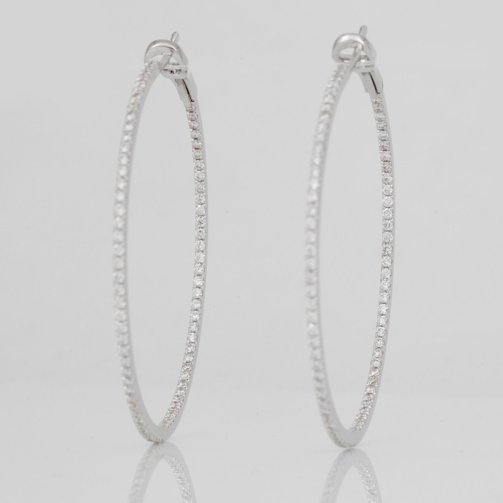 A pair of brilliant-cut diamond hoop earrings. Total carat weight circa 1.80 cts.